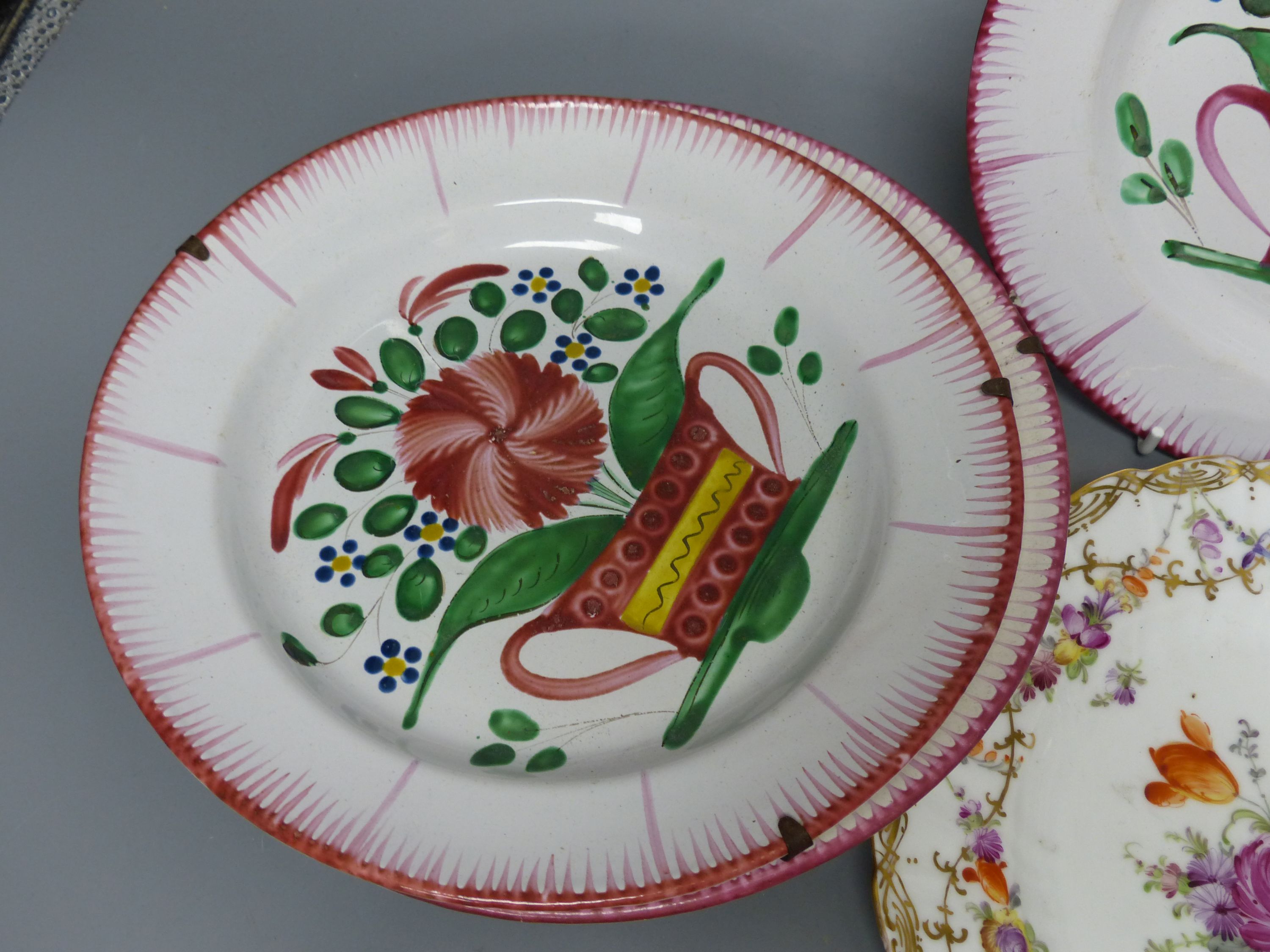 Seven French faience plates and a Dresden plate